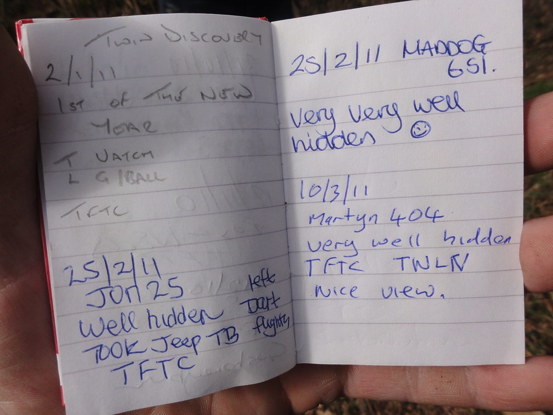 A small, pocket-sized notebook with handwritten entries documenting outdoor activities.